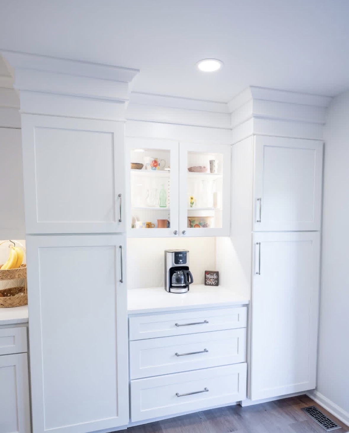 White kitchen cabinets and built-in coffee bar