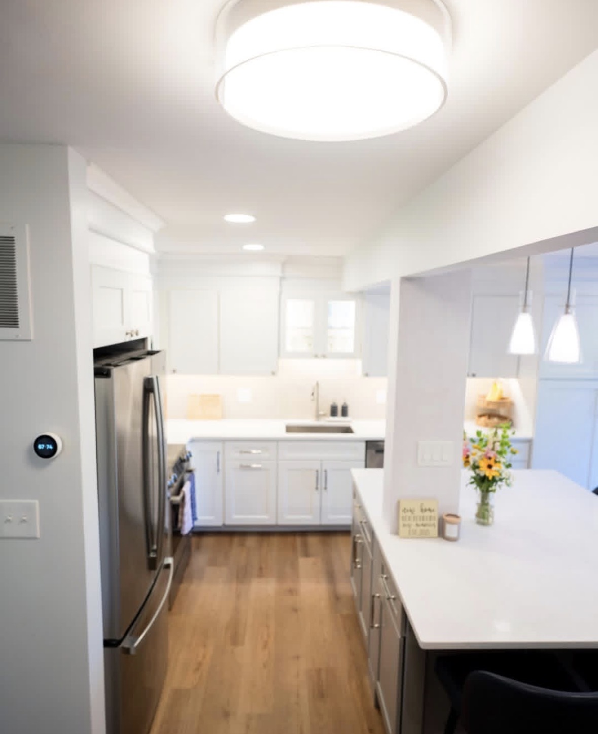 Completed kitchen with island and open connection to dining area